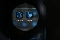 Artificial intelligence (AI) assistants ChatGPT by US Company OpenAI and Claude by US AI safety and research company Anthropic displayed on a smartphone's screen. Photo by Nicolas Tucat/AFP