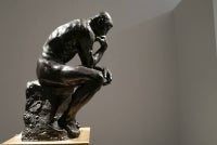 The sculpture “The Thinker” by Auguste Rodin, which is part of a collection titled "Le Grand Style: An apartment on the Quai d’Orsay" curated by Alberto Pinto, during a touring exhibition at Christie’s New York, April 8, 2022. - (Photo by TIMOTHY A. CLARY / AFP)