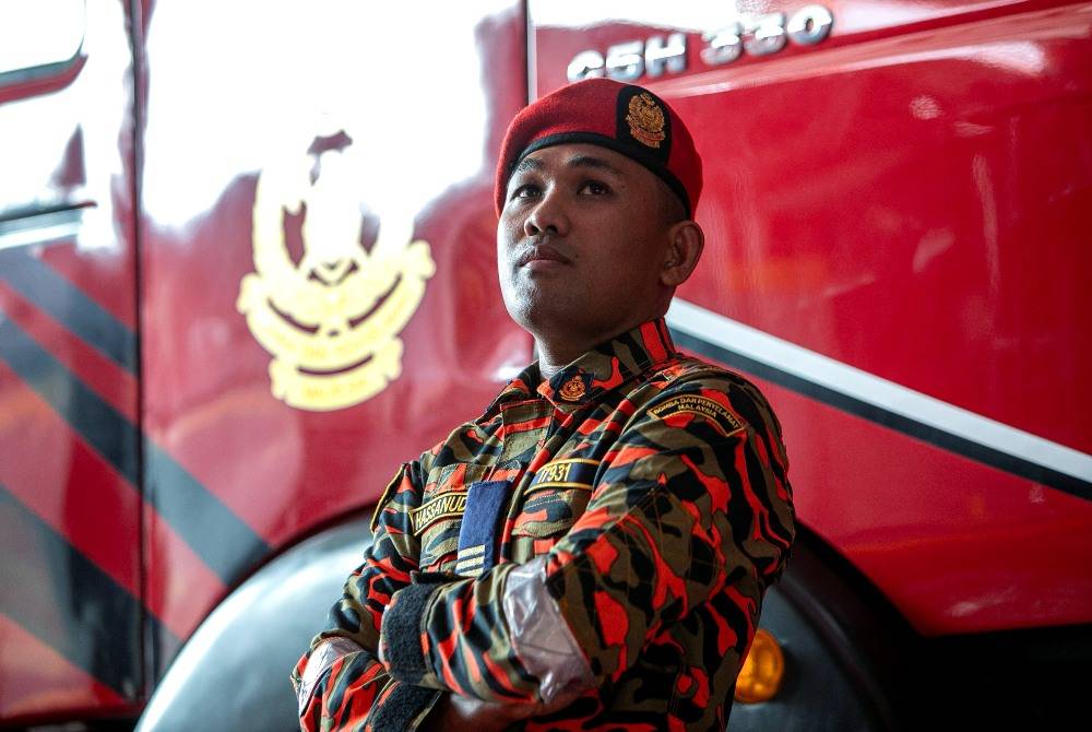 Senior Fire Officer I Hassanuddin Tabaddang, a member of JBPM’s Special Tactical Operation and Rescue Team of Malaysia (STORM) during an interview by Bernama at the Ipoh fire station, recently. - Photo by Bernama