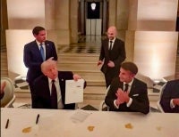 US President Donald Trump (left) and France's President Emmanuel Macron (right) during the signing of a deal with Iran to end the Middle East war, inside Chateau de Versailles, in Versailles southwest of Paris. Photo by @EmmanuelMacron/X/AFP