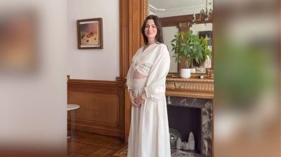 Anne Hathaway has announced she is pregnant, sharing the news in an Instagram video while wearing a flowing white dress and showing off her baby bump.