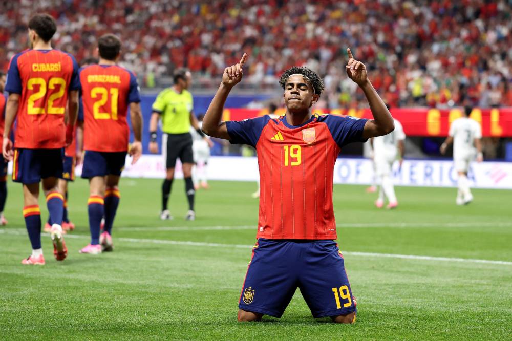 ATLANTA, GEORGIA - JUNE 21: Lamine Yamal #19 of Spain celebrates with teammate Rodri #16 after scoring his team's first goal during the FIFA World Cup 2026 Group H match between Spain and Saudi Arabia at Atlanta Stadium on June 21, 2026 in Atlanta, Georgia. (Photo by Justin Setterfield / AFP)