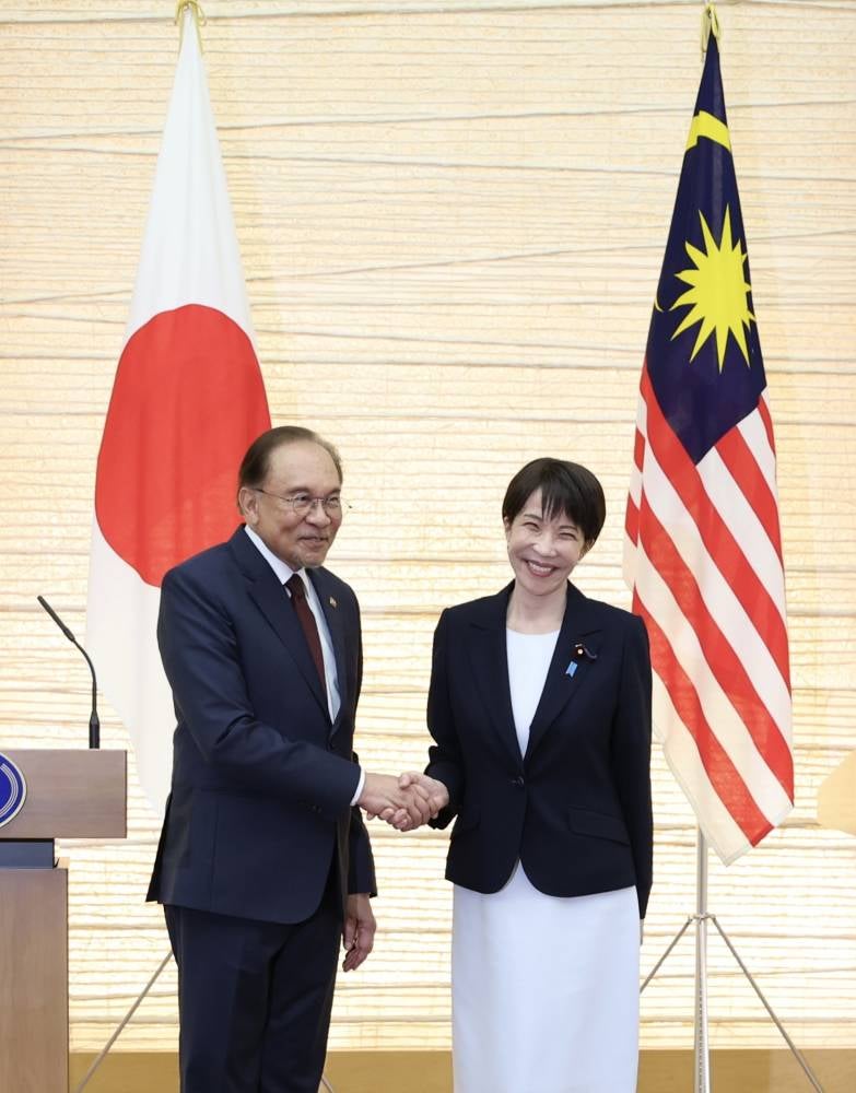 Prime Minister Datuk Seri Anwar Ibrahim shakes hands with his Japanese counterpart Sanae Takaichi during an official welcoming ceremony at the Prime Minister's Office in June 2026. BERNAMA file photo.