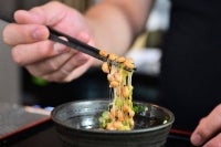 The highly nutritious beans inoculated with beneficial bacteria remain a traditional Japanese breakfast staple, but their pungent aroma, viscous texture and yeasty taste divide even their homeland. Photo by Frederic J. Brown/AFP