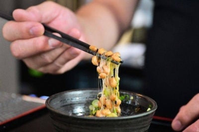 The highly nutritious beans inoculated with beneficial bacteria remain a traditional Japanese breakfast staple, but their pungent aroma, viscous texture and yeasty taste divide even their homeland. Photo by Frederic J. Brown/AFP