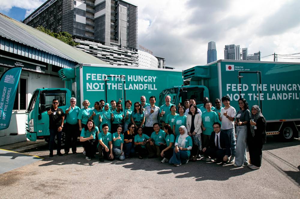 Japan Ambassador to Malaysia Noriyuki Shikata (centre) poses for a group photograph with representatives of The Lost Food Project (TLFP), sponsors and partners during the official handover ceremony of two Japanese-manufactured Isuzu refrigerated trucks funded under Japan's Grant Assistance for Grassroots Human Security Projects (GGP). BERNAMA photo.
