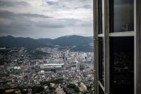 A general view of Nagasaki is seen from the observation deck of Inasayama on Aug 8, 2025 ahead of the 80th anniversary of the atomic bombing of Nagasaki. - (Photo by PHILIP FONG / AFP)