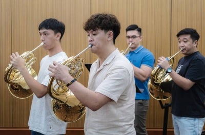Long before audiences notice the sweeping violins or dramatic piano passages in an orchestra, instruments such as the oboe and French horn are already shaping the emotional atmosphere behind the music. - Photo by Bernama