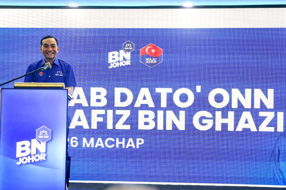 Johor BN chairman Datuk Onn Hafiz Ghazi announcing his candidacy for the N26 Machap seat during the Barisan Nasional Candidate Announcement Ceremony for the 16th Johor state election at the Johor State Umno Liaison Body in Johor Bahru, yesterday. - Photo by Bernama