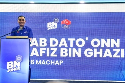 Johor BN chairman Datuk Onn Hafiz Ghazi announcing his candidacy for the N26 Machap seat during the Barisan Nasional Candidate Announcement Ceremony for the 16th Johor state election at the Johor State Umno Liaison Body in Johor Bahru, yesterday. - Photo by Bernama