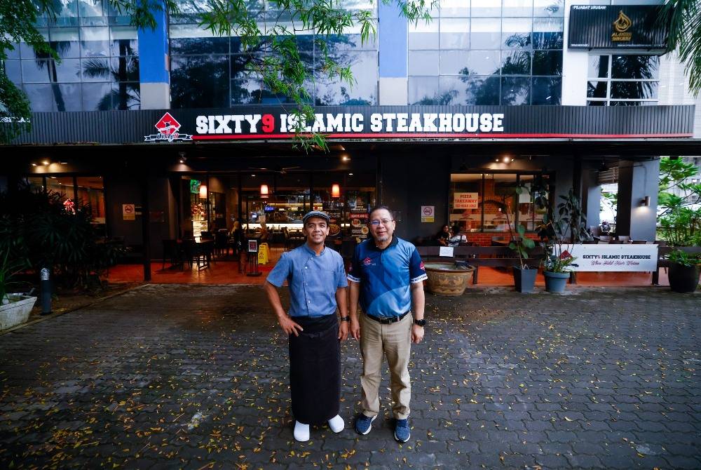 Kamarulzaman Mohd Nasir, 57 (right) with Chef Sabri Hassan at Sixty9 Islamic Steakhouse, recently. - Photo by Bernama