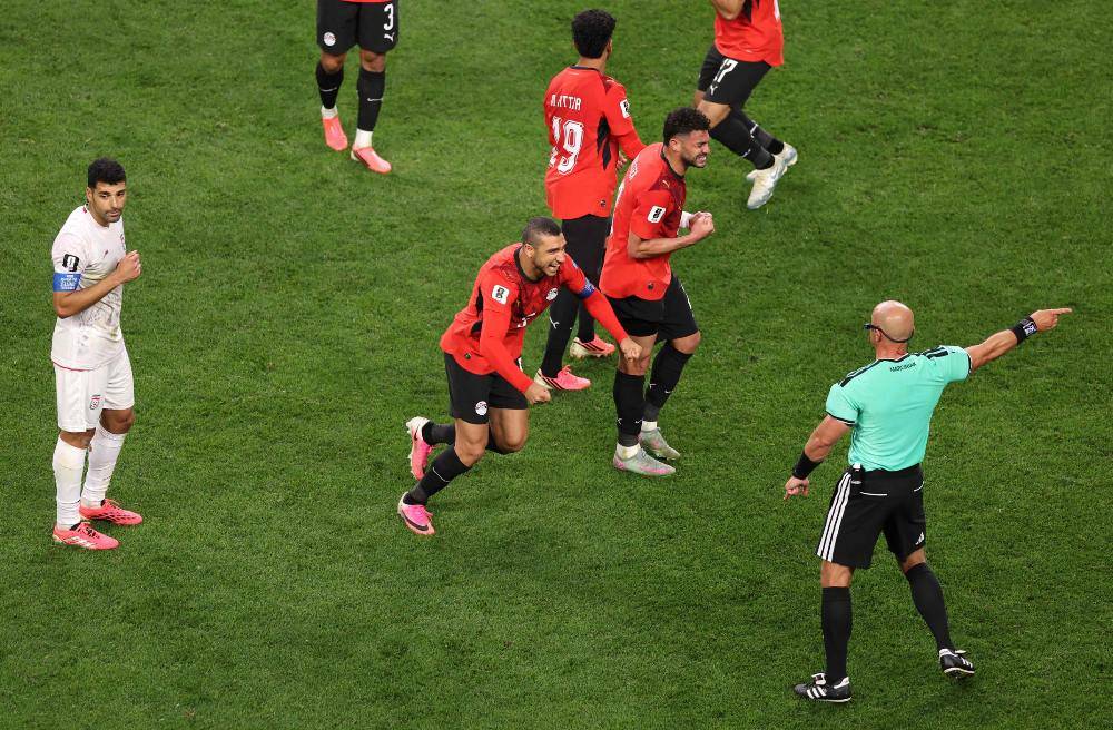 Egypt players react as referee Szymon Marciniak calls an offside violation and overturns the goal by Shoja Khalilzadeh #4 of IR Iran following a VAR review during the FIFA World Cup 2026 Group G match between Egypt and IR Iran at Seattle Stadium on June 26. Photo by AFP