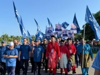 Muhyiddin (fourth from left) accompanies Bersatu-PN candidate Dr Sahruddin (fourth from right) for the Bukit Kepong state seat on Saturday.