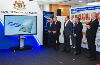 Prime Minister Datuk Seri Anwar Ibrahim (fourth, right) launched the new version of the International Malaysian Passport (PMA), which comes equipped with 94 security features, at the Parliament Lobby today. BERNAMA photo.
