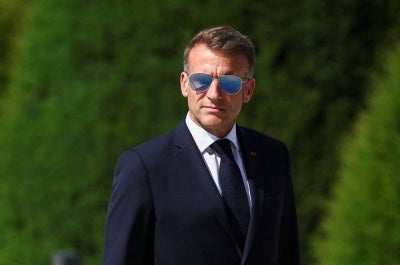 TOPSHOT - France's President Emmanuel Macron looks on during a welcoming ceremony for Thailand's King Maha Vajiralongkorn and Queen Suthida (not pictured) in the courtyard of the Hotel des Invalides in Paris on June 29, 2026, as part of an official state visit of the Thai King to France. The King of Thailand is visiting France from June 28 to July 2, the first by a Thai monarch to France since 1960, marking the 170th anniversary of the establishment of diplomatic relations between the two countries. (Photo by Abdul Saboor / POOL / AFP)