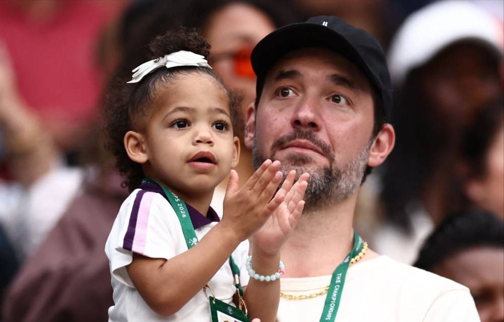 US player Serena Williams' husband Alexis Ohanian and her child Adira. Photo by AFP