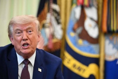 US President Donald Trump speaks to the press in the Oval Office of the White House in Washington, DC. AFP photo.