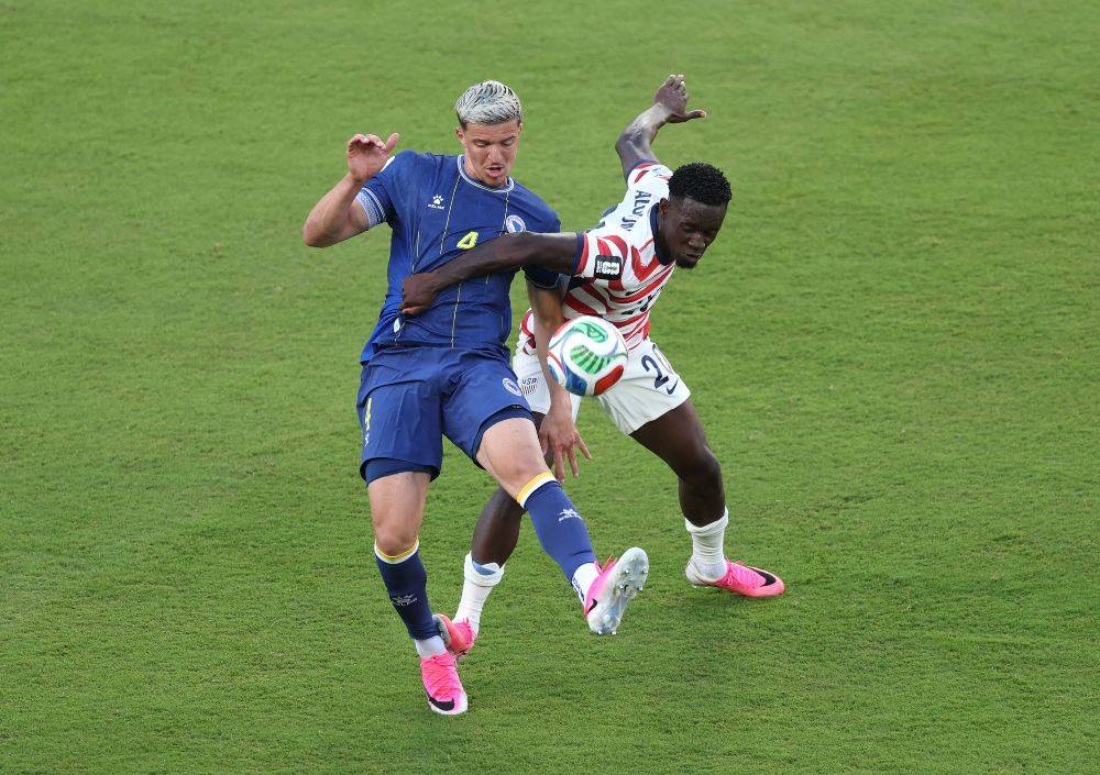 Folarin Balogun #20 of the United States fouls Tarik Muharemovic #4 of Bosnia and Herzegovina which is later reviewed by VAR and awarded as a red card foul a during the FIFA World Cup 2026 Round of 32 match between USA and Bosnia and Herzegovina at San Francisco Bay Area Stadium. Photo by AFP