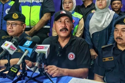 AADK director-general Datuk Ruslin Jusoh (middle) and JPJ director-general Datuk Aedy Fadly Ramly (left) during a press conference after the operation at the Seremban Southbound R&R area.