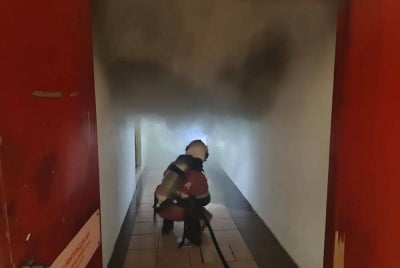 Shoppers at Kompleks PKNS in Section 14 were startled on Tuesday after smoke filled parts of the building due to a fire in an air-conditioning system room. Photo courtesy of Selangor Fire and Rescue Department. 