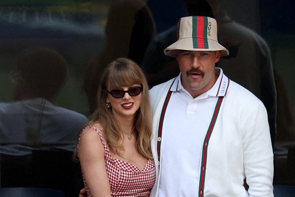 Singer-songwriter Taylor Swift and Travis Kelce of the Kansas City Chiefs attend the Men's Singles Final match between Taylor Fritz of the United States and Jannik Sinner of Italy on Day Fourteen of the 2024 US Open at USTA Billie Jean King National Tennis Center on Sept 8, 2024 in the Flushing neighborhood of the Queens borough of New York City. - (Photo by JAMIE SQUIRE / Getty Images via AFP)