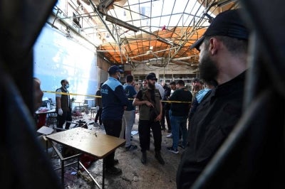 Syrian security forces gather at the site of an explosion at a cafe in the capital Damascus on July 2, 2026. A bomb went off at a cafe in central Damascus on on July 2, killing at least five people and wounding 16, Syrian authorities said. The blast took place near the capital's Palace of Justice, a key government building, sparking scenes of panic in the busy area. (Photo by LOUAI BESHARA / AFP)