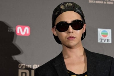 In this picture taken on Nov 22, 2013, Big Bang's G-Dragon, who won best artist and best male solo dance performance, attends a press conference ahead of the start of the Mnet Asian Music Awards (MAMA) at Asia-World Expo in Hong Kong. - (Photo by ANTHONY WALLACE / AFP)