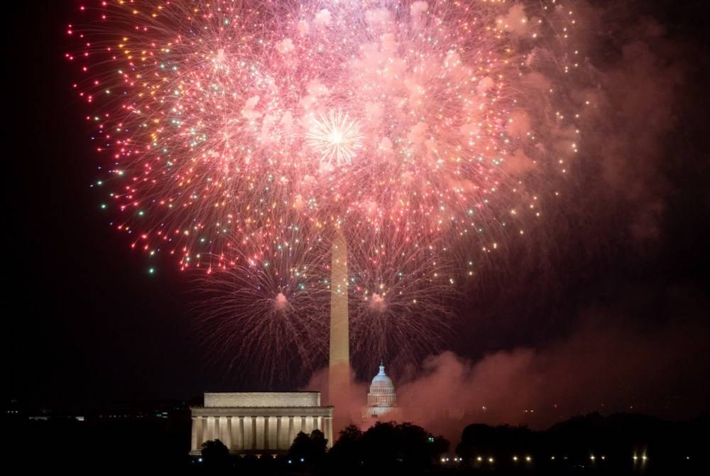 The US Capitol and Washington Monument are seen during the Independence Day fireworks display along the National Mall in Washington, DC, on July 4, 2023. - (Photo by Stefani Reynolds / AFP)