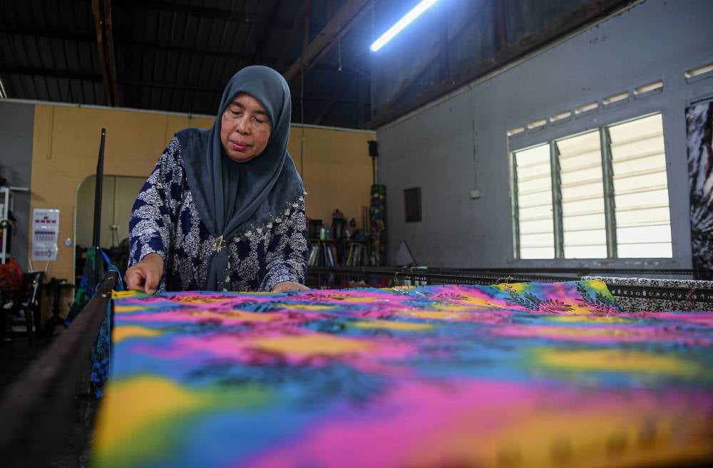 Johor Batik pioneer Maimunah Yaacob, 58, has spent 31 years promoting the art form in the state. - Photo by Bernama