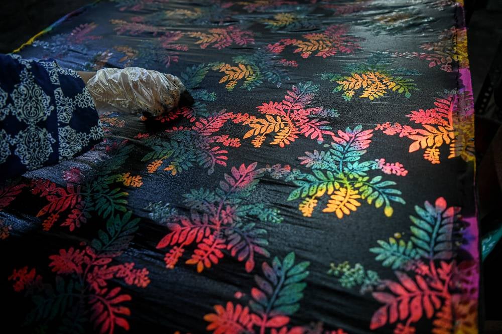 Johor Batik pioneer Maimunah Yaacob, 58, said Johor Batik is distinguished by motifs inspired by the state's natural environment, history and cultural heritage. - Photo by Bernama