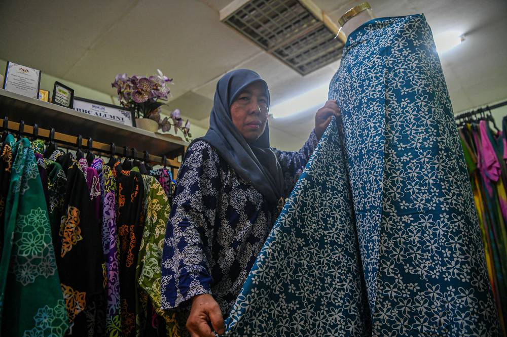Johor Batik pioneer Maimunah Yaacob, 58, said Johor Batik is distinguished by motifs inspired by the state's natural environment, history and cultural heritage. - Photo by Bernama