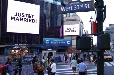 A giant screen shows the message "JUST&T MARRIED!" (T&T for Taylor and Travis) outside Madison Square Garden, the reported venue for the wedding celebrations of pop singer Taylor Swift and pro-athlete Travis Kelce, in New York City on July 3, 2026. - (Photo by CHARLY TRIBALLEAU / AFP)