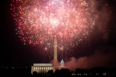 The US Capitol and Washington Monument are seen during the Independence Day fireworks display along the National Mall in Washington, DC, on July 4, 2023. - (Photo by Stefani Reynolds / AFP)