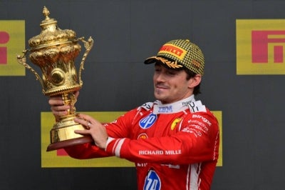 Ferrari's Charles Leclerc won on Sunday's British Grand Prix in dramatic fashion after championship leader Kimi Antonelli's victory bid was wrecked by a mechanical problem, while a late Safety Car helped George Russell snatch second place from Lewis Hamilton. (Photo by Andrej ISAKOVIC / AFP)