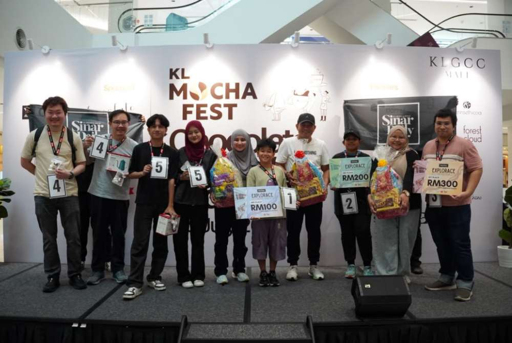 Participants of the KL Mocha Fest Explorace pose after completing a series of coffee and chocolate-themed challenges, which tested their teamwork, creativity and problem-solving skills.