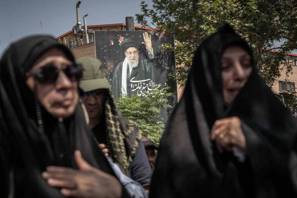 Mourners react as they attend the funeral procession of Iran's slain supreme leader Ali Khamenei and his family members, along a street in Tehran July 6, 2026. Vast crowds gathered for the funeral procession of Iran's slain supreme leader Ali Khamenei in Tehran on July 6, with authorities estimating millions were on the streets in numbers that could rival those of his predecessor's farewell nearly four decades ago. (Photo by AFP)