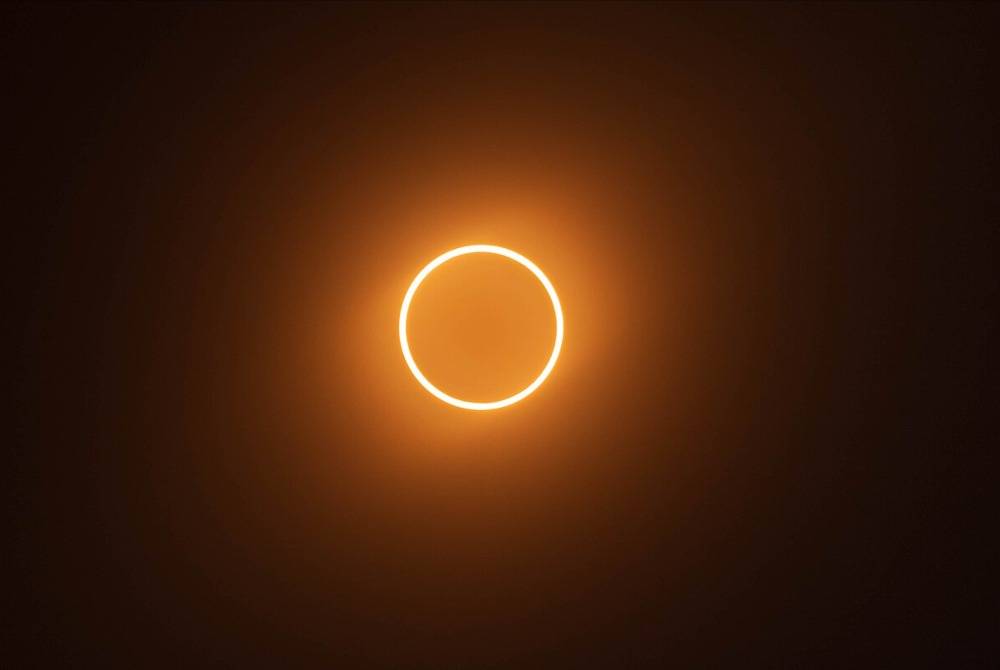 An annular solar eclipse occurs when the Moon is too far away to completely cover the Sun's disk ( Source: Wikipedia)