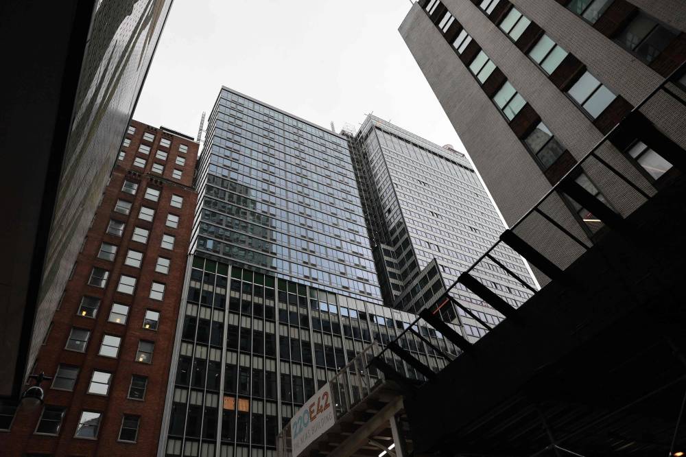 The former Pfizer headquarters building is seen on July 7, 2026 in New York City. Construction workers working on the former pharmaceutical company building, a high-profile housing project, were evacuated after it was determined that it was at risk of collapse. - (Photo by Michael M. Santiago / Getty Images via AFP)