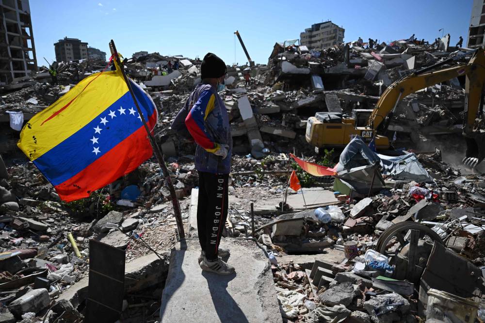 Earthquakes measuring 7.2 and 7.5 magnitude struck Venezuela on June 24, followed by more than a thousand weaker aftershocks. Numerous buildings have been reduced to rubble, particularly in the coastal state of La Guaira.(Photo by Raul ARBOLEDA / AFP)
