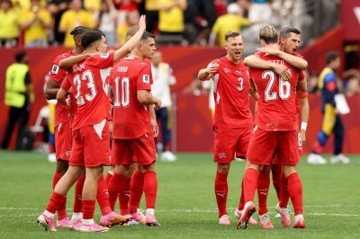 Switzerland players celebrate their win against Colombia in the round of 16 of the 2026 FIFA World Cup (Photo by Carl Recine / GETTY IMAGES NORTH AMERICA / Getty Images via AFP)