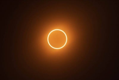 An annular solar eclipse occurs when the Moon is too far away to completely cover the Sun's disk ( Source: Wikipedia)