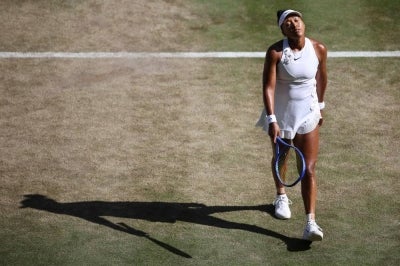 Japan's Naomi Osaka, devastated with her loss against Czech Republic's Karolina Muchova during their women's singles quarter-final tennis match on the ninth day of the 2026 Wimbledon Championships at The All England Lawn Tennis and Croquet Club in Wimbledon, southwest London, on July 7, 2026. (Photo by Henry NICHOLLS / AFP) / RESTRICTED TO EDITORIAL USE