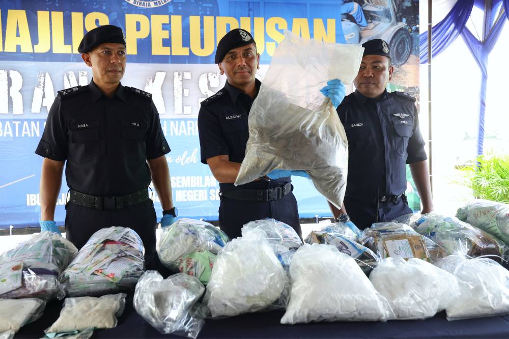 Negeri Sembilan police chief Datuk Alzafny Ahmad shows various seized drugs following a press conference held in conjunction with the Drug Case Exhibit Disposal Ceremony at the Negeri Sembilan Contingent Police Headquarters. BERNAMA photo