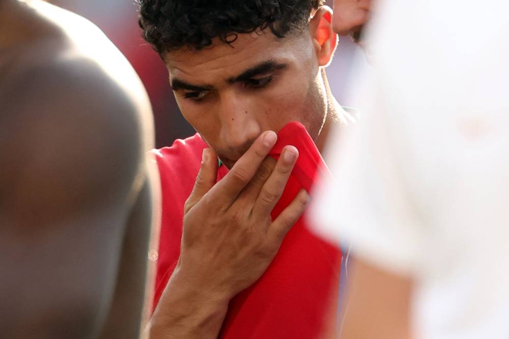 A dejected Achraf Hakimi after losing the 2026 World Cup football tournament quarter-final match between France and Morocco at Boston Stadium in Foxborough on July 9, 2026. (Photo by Odd ANDERSEN / AFP)