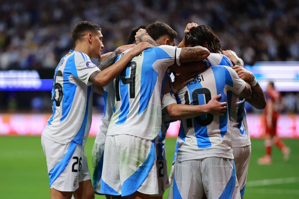 Players of Argentina celebrate after scoring a goal during the World Cup. AFP photo