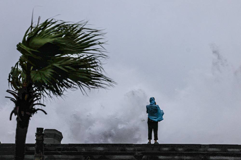 Typhoon Bavi passes off northeastern Taiwan, in Keelung on July 11, 2026. (Photo by I-Hwa Cheng / AFP)