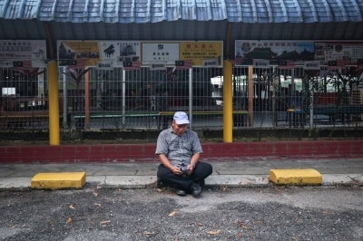 Rahmat Shukor, 57, who is self-employed, expressed his sadness and disappointment at being unable to cast his vote after becoming caught in severe traffic congestion while travelling from Batu Pahat to Johor Bahru. Photo by Bernama