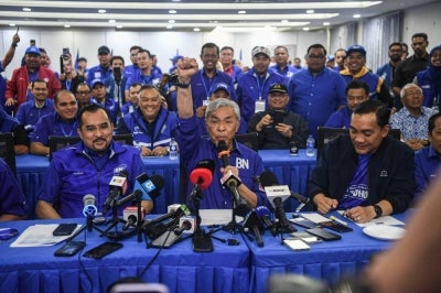 Deputy Prime Minister and Barisan Nasional President Datuk Seri Dr Ahmad Zahid Hamidi (centre) speaks during a press conference regarding the unofficial results of the 16th Johor state election at the Johor State Umno Liaison Building on July 11. BERNAMA photo