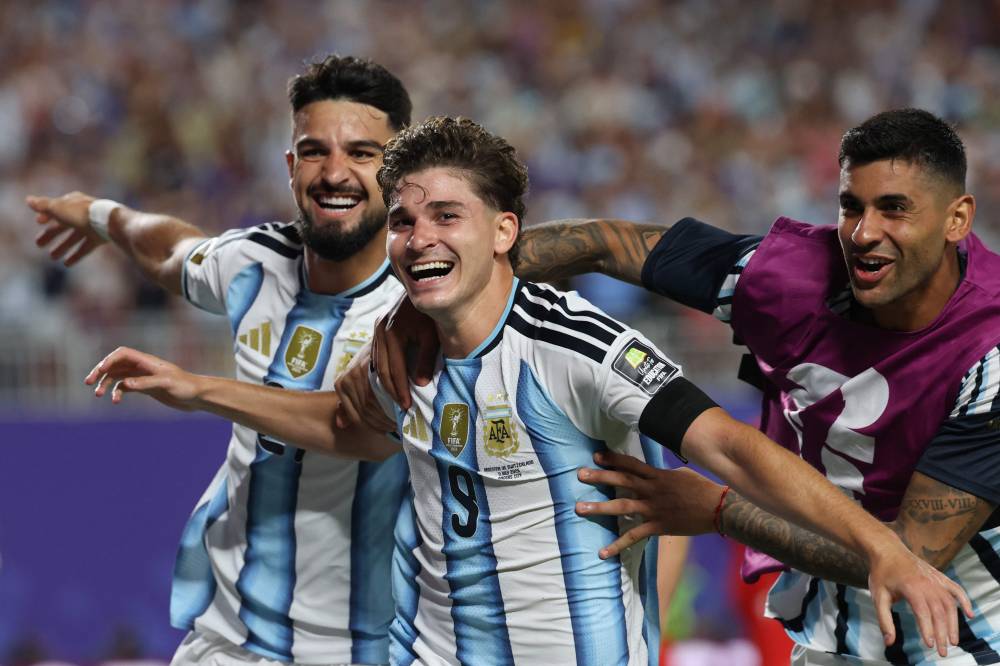 Alvarez (middle) curled a breathtaking strike into the top corner in the 112th minute.(Photo by Odd ANDERSEN / AFP)