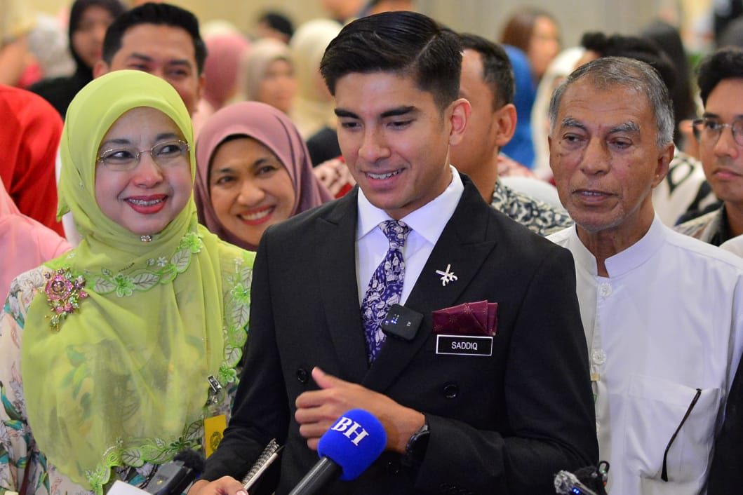 Syed Saddiq (centre) during a press conference after the court's decision. With him are his parents. (PHOTO BY ASRIL ASWANDI SHUKOR)